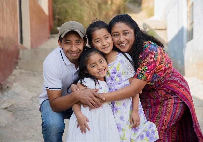 A smiling latino family