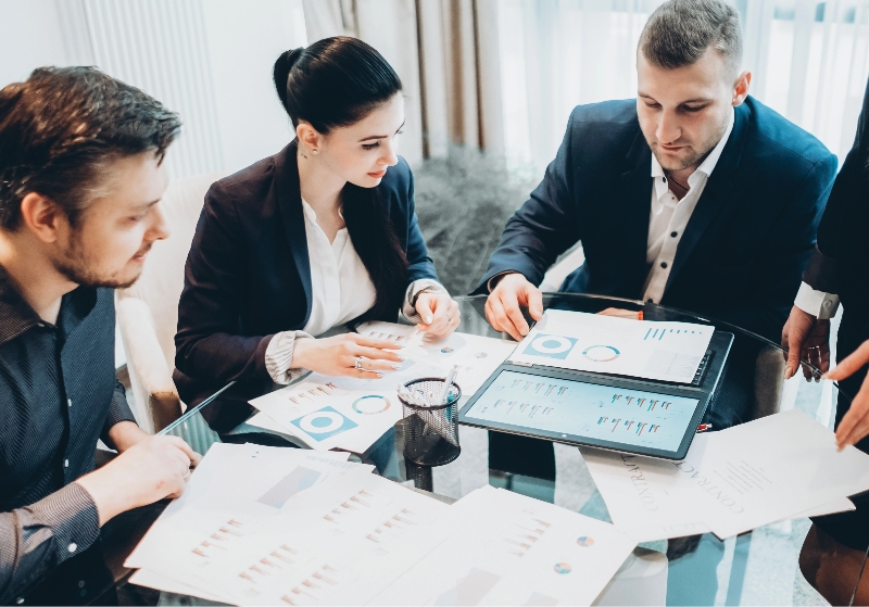 Business partners working on project at a meeting