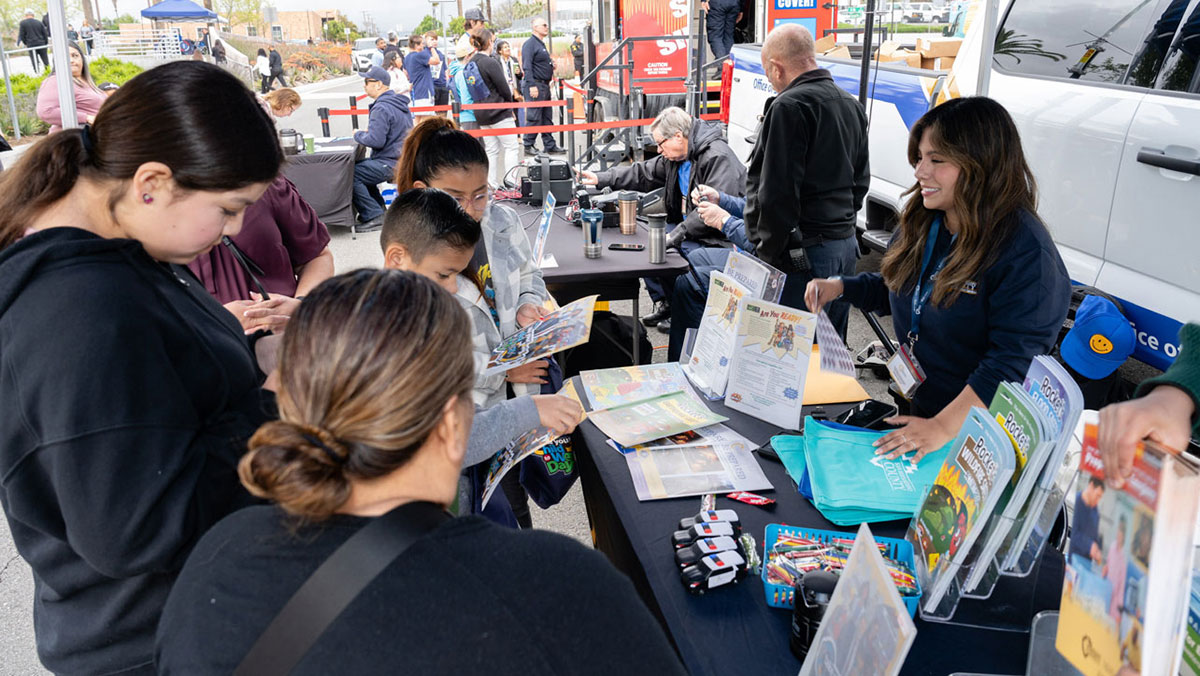 Residents collect information from OES information booth