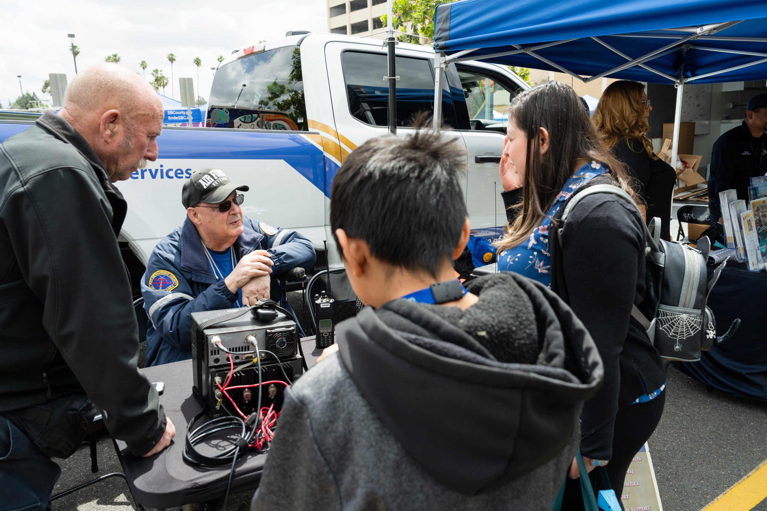 ECS team with ham radios showing talking to the kids