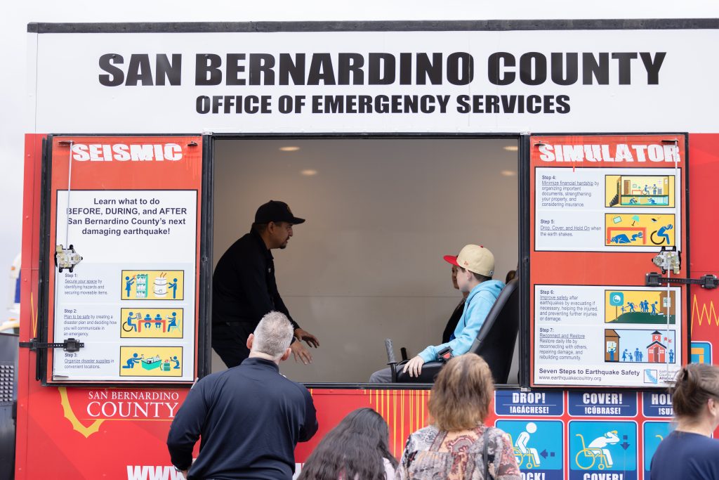 earthquake simulator with someone inside briefing the riders